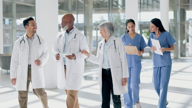 Teamwork, planning and tablet with doctors in hospital for meeting, advice and medical. Medicine, healthcare and research with group of people walking in clinic for consulting, help and diversity