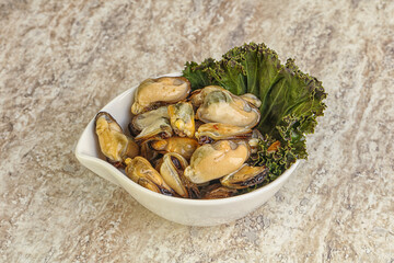 Tasty marinated mussels in the bowl