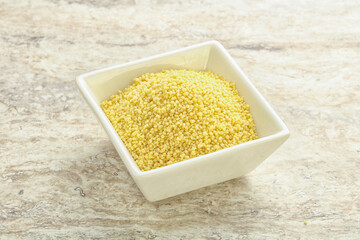 Raw couscous in the bowl