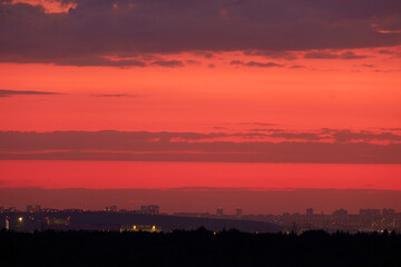 The view from the top of the building at sunset was stunning, with the night city skyline laid out...