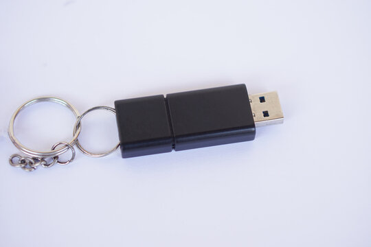 USB memory stick with information storage, on white background. Small, portable device that plugs into USB port on computer to data backup, storage or transfer files between devices.      