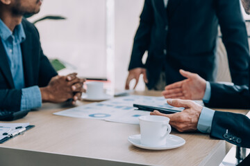 Entrepreneurs and business people conference in modern meeting room, happy multiracial coworkers have fun cooperating working together at office meeting, asian teamwork concept