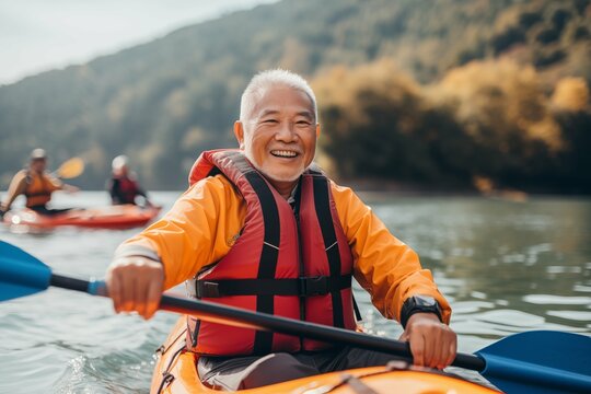 An elderly man with friends, families, kayaking on the water