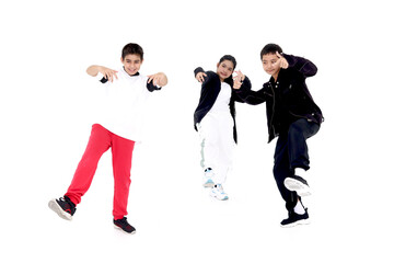Fototapeta na wymiar Happy student kid group studying modern style dance in indoor studio classroom, children, boys and girl, dancing on white background. Three little dancers practicing break dance together.