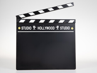 clapperboard black cinema with text hollywood studio and stars in movies concept on white background