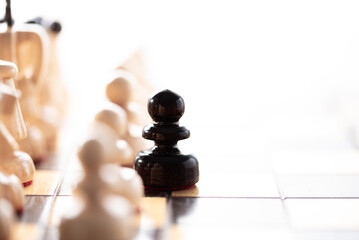 anymore in your game.
Black pawn moving away from the white pieces, close up - 677063052