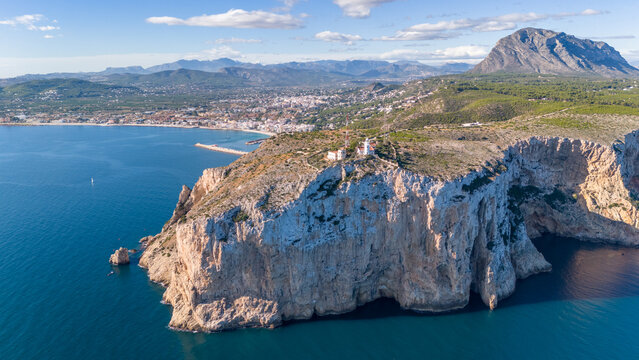 Aerial drone photo of the lighthouse at the cliffs of Cap de Sant Antoni in Javea, Spain