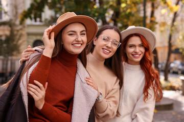 Portrait of happy friends spending time together outdoors