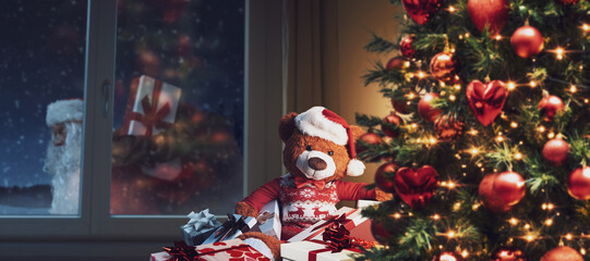 Teddy bear waiting for Santa Claus on Christmas Eve