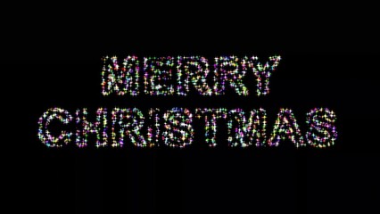 Merry Christmas with colorful glitter sparkles on plain black background