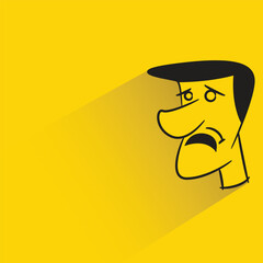 sad man with shadow on yellow background