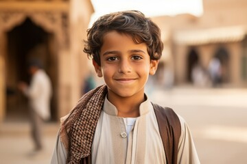 an arab little boy smile at camera