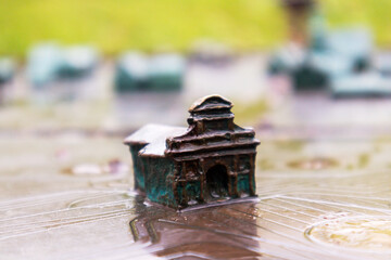 .A small house cast in bronze as a decorative element
