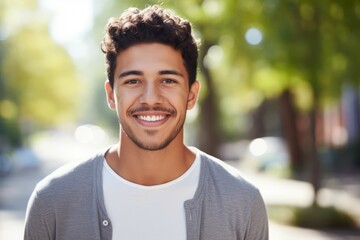 Obraz premium a hispanic young man smile at camera