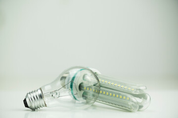 Naklejka premium tungsten bulb next to long led bulb