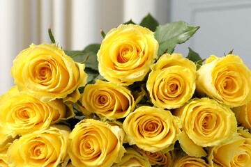 Beautiful bouquet of yellow roses against blurred background, closeup