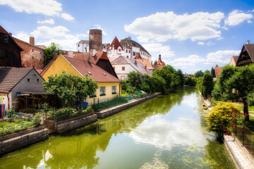 Fototapeta na wymiar The Nezarka River Floating through Jindrichuv Hradec in the Czech Republic, with the Famous Castle