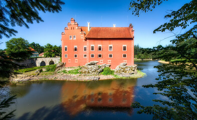 The Small, Charming Cervena Lhota Castle in a Lake in South Bohemia in the Czech Republic - obrazy, fototapety, plakaty
