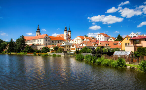 View towards the Castle of Telc in the Czech Republic, with the Name of Jesus Church and the Tower of the Church of St James