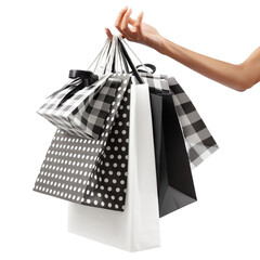 Female hand holding many shopping bag black and white color, isolated on white background. Concept...