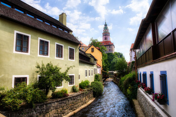 Fototapeta na wymiar Beautiful Cesky Krumlov in the Czech Republic, with a Canal Flowing towards the Vltava River and the Castle Dominating the City