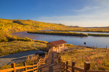 A small dock and wooden walkway on the slope by the Erguna River in Hulunbuir, Inner Mongolia,...