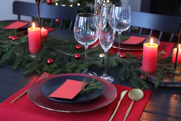 Elegant Christmas table setting with blank place cards and festive decor