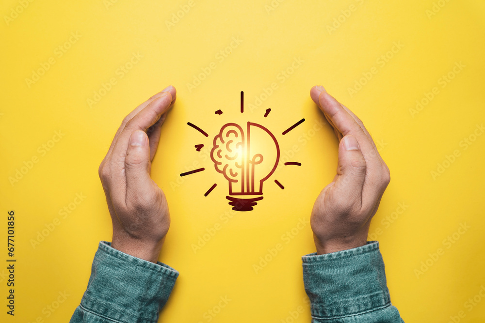 Poster two hand protect glowing lightbulb on yellow background for prevent patent and idea of problem solvi