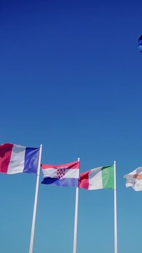 Flags of European Union and countries against the blue sky