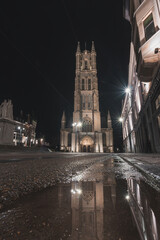 Sint-Baafskathedraal in the historic part of Ghent during the night. Belfry of Ghent. Belgium's...