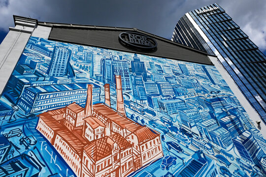 Warsaw, Wola, Poland, Europe - Mural painting showing Fabryka Norblina - Norblin Factory on map of Warsaw, right - mBank Tower skyscraper, Mennica Legacy Tower 