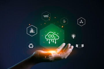 Carbon credit market concept. carbon credit icon in hand. Decreasing CO2 emissions target symbol on...