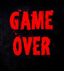 text game over in red with splashes and stains on a black background
