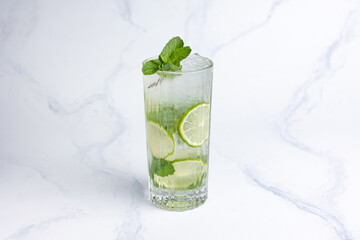 Alcoholic mojito cocktail with lime and mint