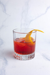 Alcoholic Negroni cocktail on a light background