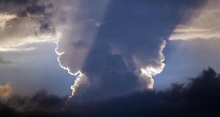 Blue sky with dark clouds