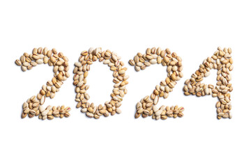 Calendar header number 2024 made of pistachio nuts on a white background. Happy New Year 2024 colorful background.