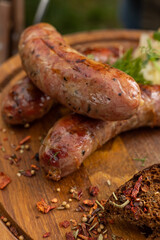 Delicious sausages on a wooden table