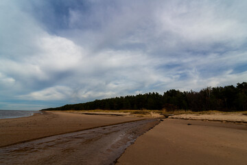 Fototapeta na wymiar Sandy baltic beach with river