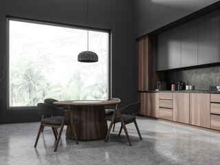 Gray and wooden kitchen corner with cabinets and dining table