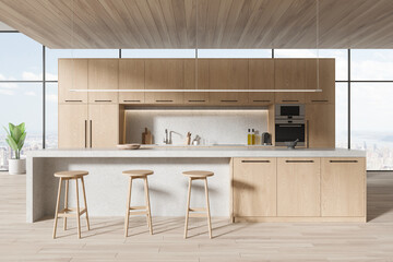Panoramic wooden kitchen interior with cabinets and island © ImageFlow