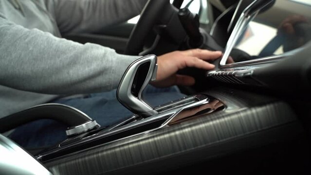 the driver starts the car with the start stop button