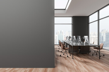 Gray open space office interior with blank wall