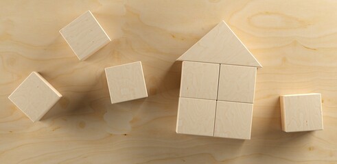 Miniature house model made from wooden blocks on wood table background, home, property or real estate business concept, flat lay top view from above
