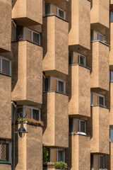 Fragment of a concrete building with windows and balconies in Warsaw, Poland