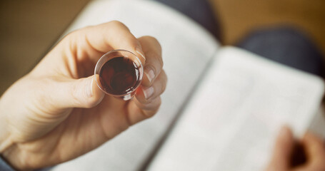 Woman taking communion - bread and wine. Christian faith and practice concept - obrazy, fototapety, plakaty
