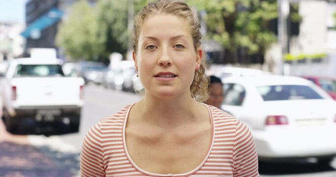 Face, woman and interview in street, conversation and communication for travel destination. Portrait, person answer question in city and talk, reporter speaking and news for holiday on tv broadcast
