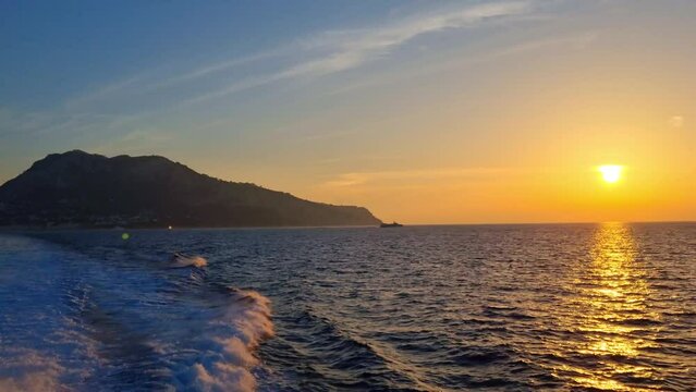 Island of Capri - Italy - Sunset when leaving the island by ship