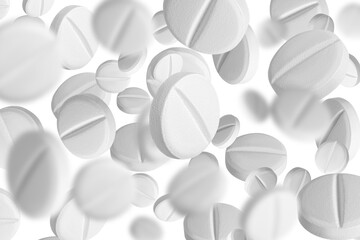 White capsules, pills or tablets flying into the air and scattering all over the background. on...