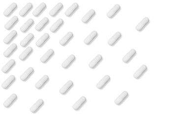 white matte pills or tablets stand in rows on an isolated background